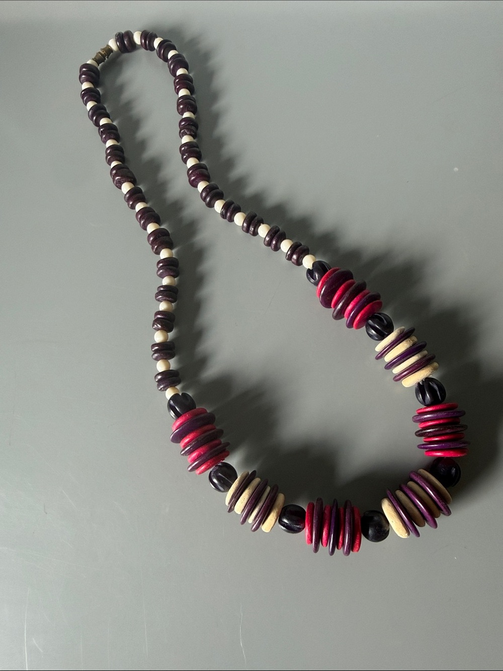Vintage boho wooden disc and bead necklace features alternating clusters